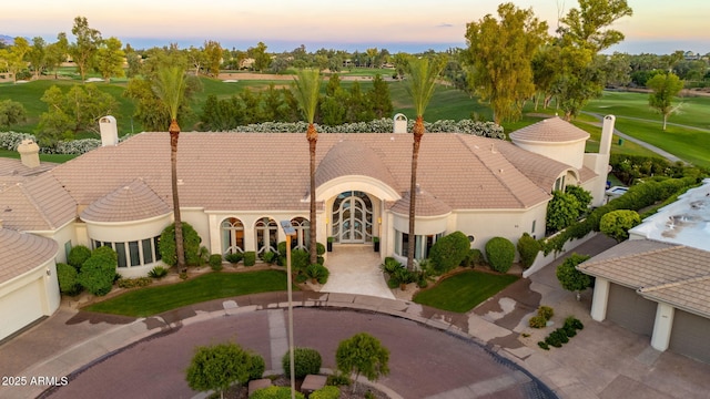 7475 E Gainey Ranch Rd Unit 22, Scottsdale, AZ 85258 - view of front of property featuring a chimney, a tile roof, golf course view, and stucco siding
