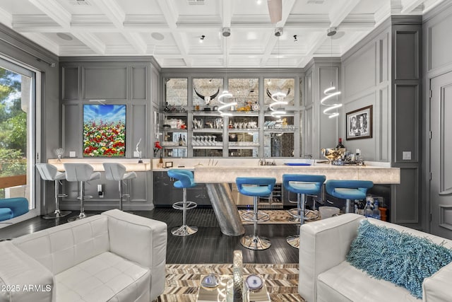 7475 E Gainey Ranch Rd Unit 22, Scottsdale, AZ 85258 - indoor wet bar with a decorative wall, coffered ceiling, beam ceiling, and wood finished floors