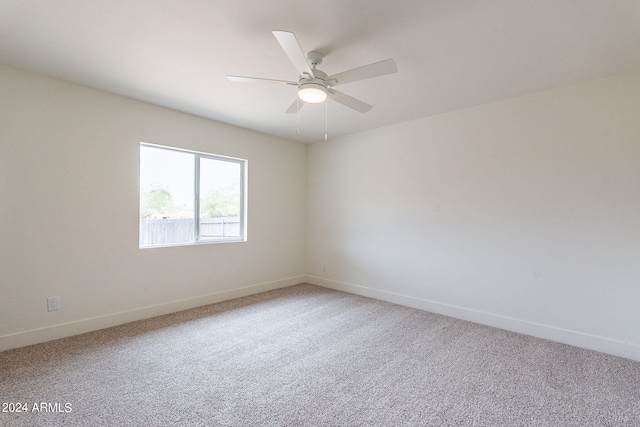 empty room featuring carpet and ceiling fan