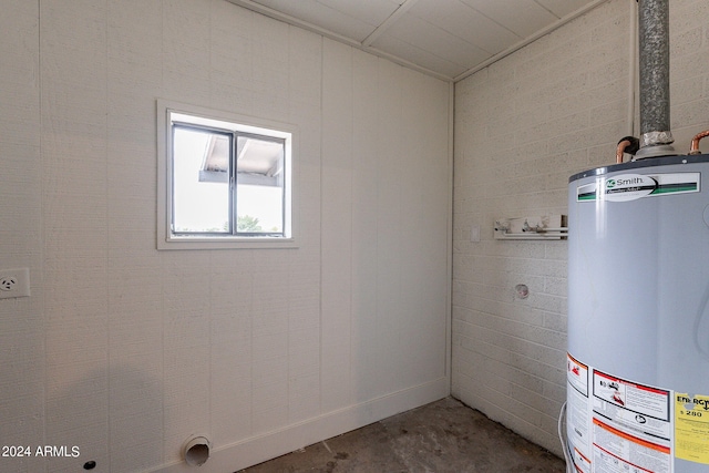 utility room featuring gas water heater