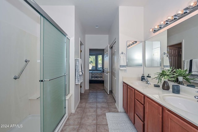 bathroom with tile patterned flooring, french doors, vanity, and an enclosed shower