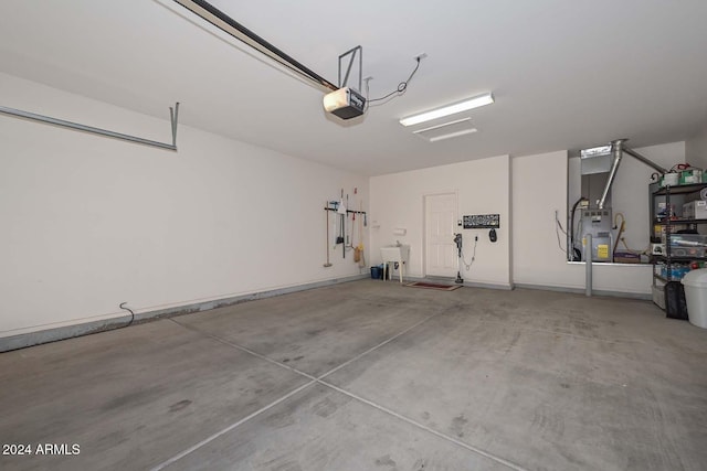 garage featuring sink and a garage door opener