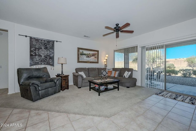 living room featuring ceiling fan and light tile patterned flooring