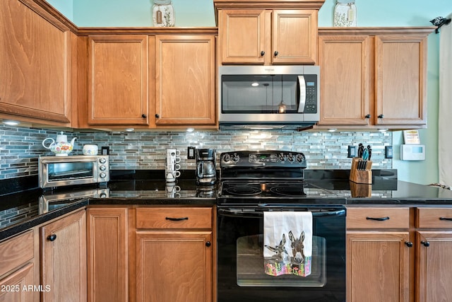 kitchen with black electric range, backsplash, and dark stone countertops