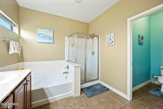 full bathroom featuring tile patterned floors, vanity, independent shower and bath, and toilet