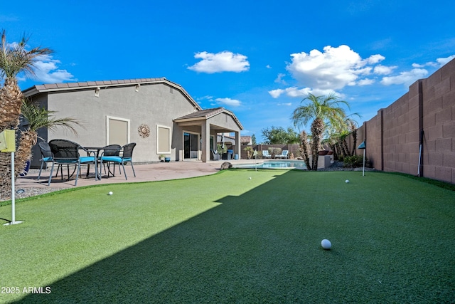 view of yard featuring a patio and a fenced in pool