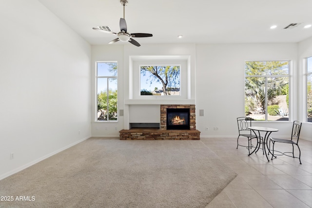 5892 E Evening Glow Dr, Scottsdale, AZ 85266 - living room with recessed lighting, visible vents, baseboards, a stone fireplace, and light tile patterned flooring