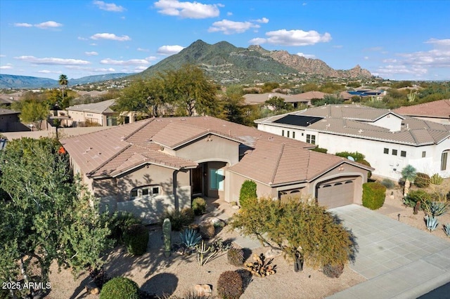 5892 E Evening Glow Dr, Scottsdale, AZ 85266 - mediterranean / spanish-style home featuring a tile roof, an attached garage, a mountain view, a residential view, and driveway
