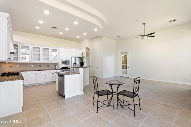 5892 E Evening Glow Dr, Scottsdale, AZ 85266 - kitchen featuring stainless steel appliances, a center island, white cabinets, and visible vents