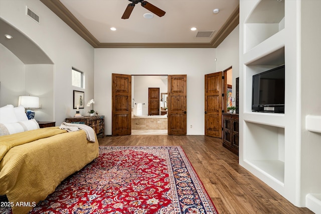 bedroom with ceiling fan, light hardwood / wood-style floors, and crown molding