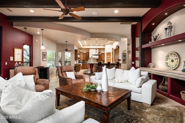 living room with ceiling fan and beam ceiling