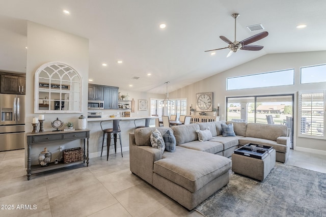 living area with high vaulted ceiling, recessed lighting, visible vents, and plenty of natural light