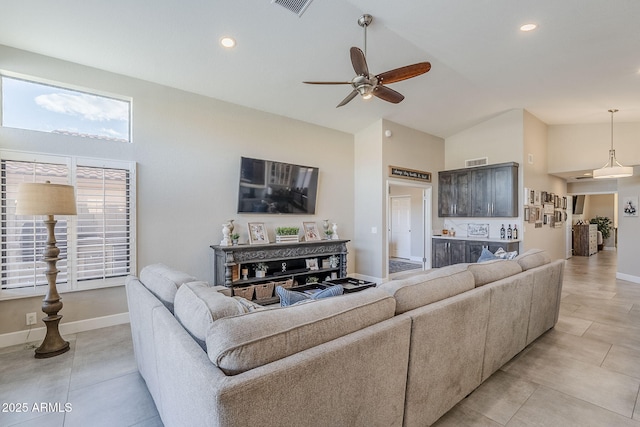 living room featuring high vaulted ceiling, visible vents, ceiling fan, and baseboards