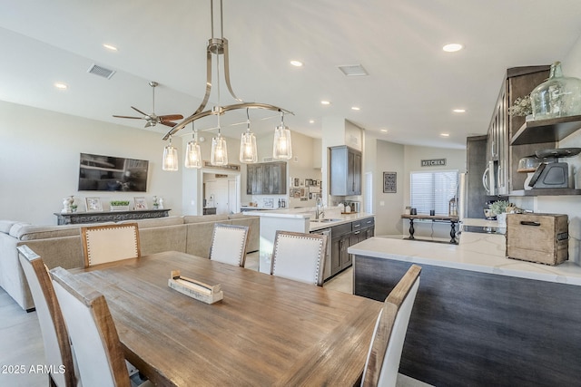 dining room with a ceiling fan, lofted ceiling, visible vents, and recessed lighting