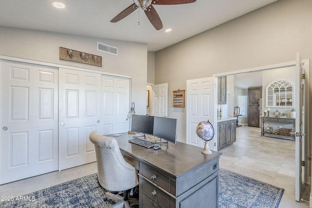 office with lofted ceiling, light tile patterned floors, visible vents, and recessed lighting