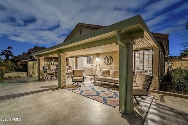 view of patio featuring fence and an outdoor hangout area