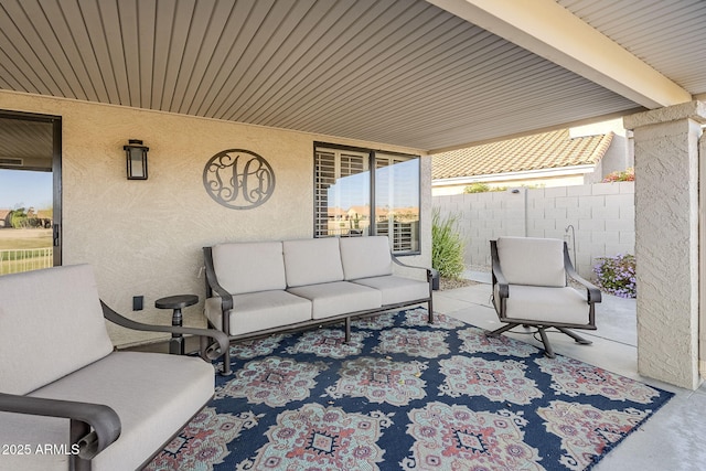 view of patio / terrace with fence and an outdoor hangout area