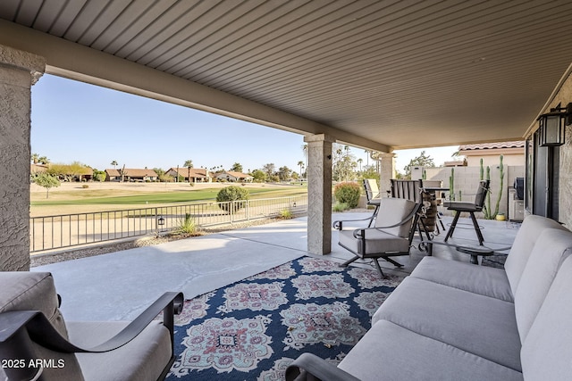 view of patio / terrace featuring outdoor lounge area and fence