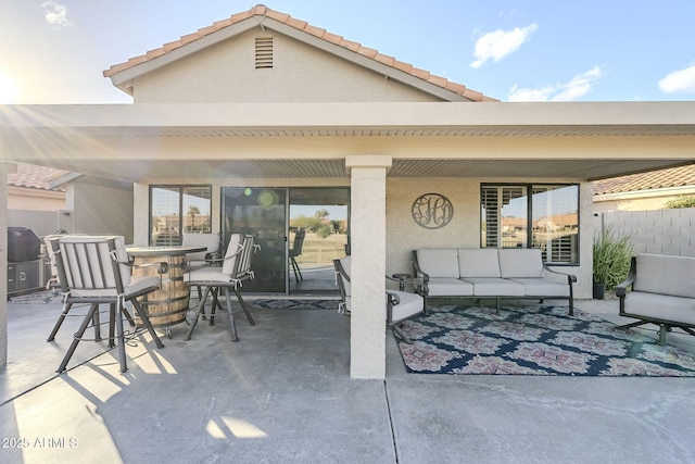 view of patio with outdoor dining space and an outdoor living space