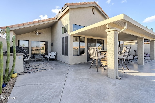 view of patio / terrace featuring fence and a ceiling fan