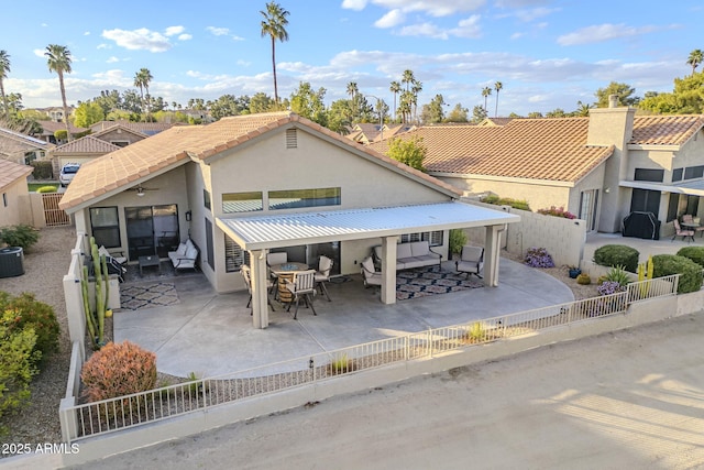 exterior space featuring stucco siding, a fenced backyard, outdoor dining space, and a patio