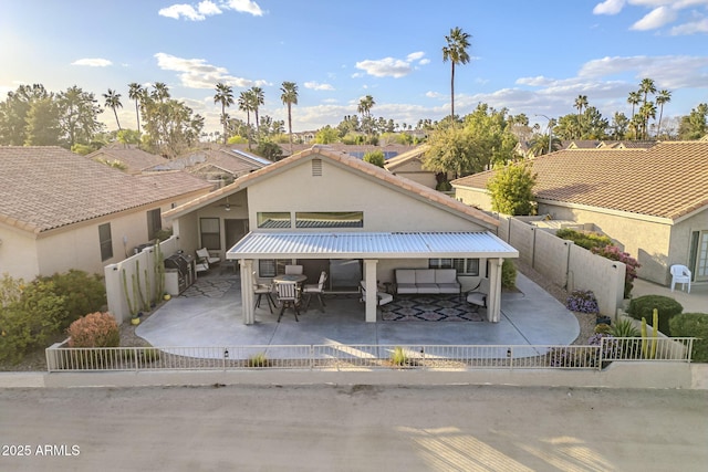 view of community with a patio area, a fenced backyard, and outdoor dining area