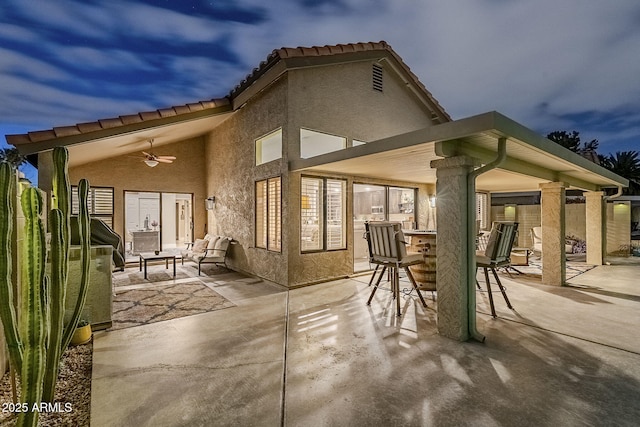 view of patio / terrace with outdoor dining area and a ceiling fan