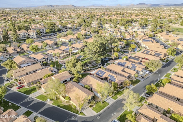 drone / aerial view featuring a residential view and a mountain view