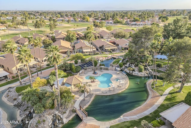 birds eye view of property featuring a residential view and a water view