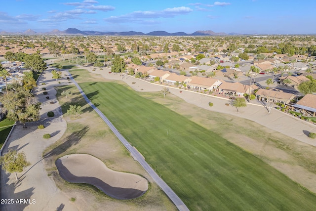 aerial view featuring a mountain view, view of golf course, and a residential view