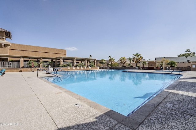 community pool with a patio area