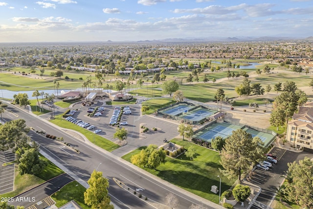 bird's eye view featuring view of golf course and a water view