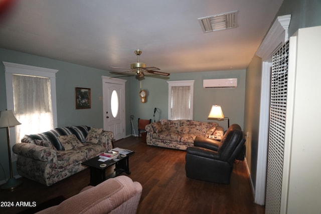 living room with ceiling fan, dark hardwood / wood-style floors, and a wall mounted air conditioner