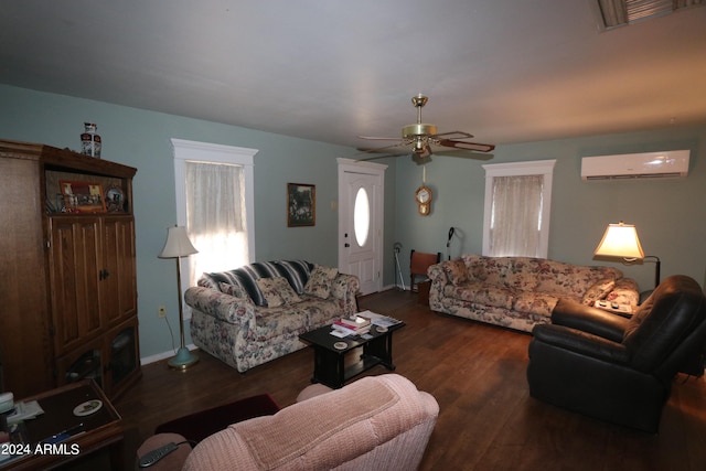 living room featuring ceiling fan, dark hardwood / wood-style flooring, and an AC wall unit