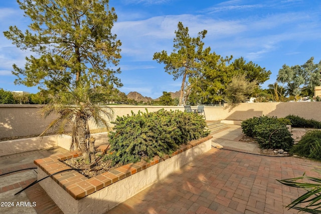 view of patio / terrace featuring a mountain view