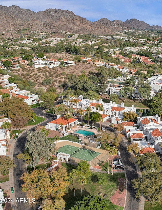 birds eye view of property with a mountain view