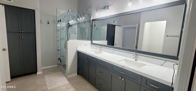 bathroom with vanity, an enclosed shower, and hardwood / wood-style flooring