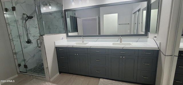 bathroom featuring vanity, a shower with shower door, and hardwood / wood-style floors