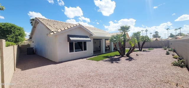 back of property featuring a patio and cooling unit