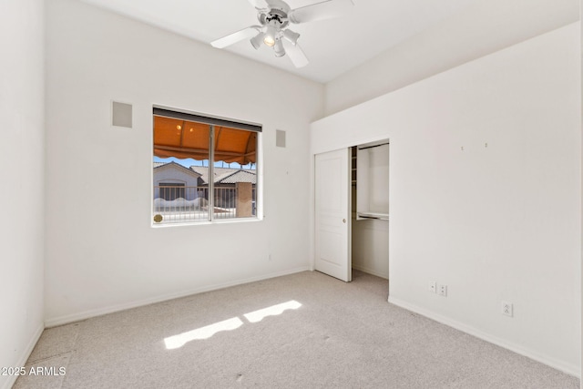 unfurnished bedroom featuring a closet, carpet, ceiling fan, and baseboards