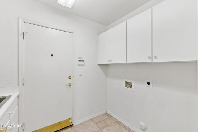 washroom with washer hookup, hookup for an electric dryer, hookup for a gas dryer, cabinet space, and baseboards