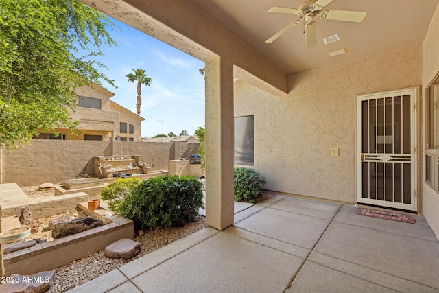 view of patio / terrace with a ceiling fan, a fenced backyard, and visible vents