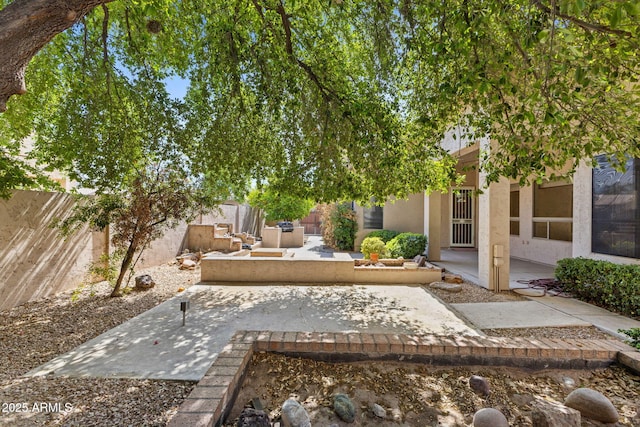 view of yard featuring a patio and a fenced backyard