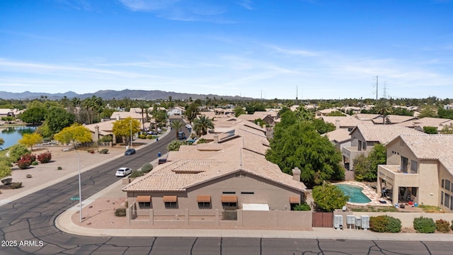 birds eye view of property with a residential view and a mountain view