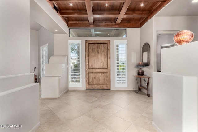 foyer featuring beamed ceiling, crown molding, coffered ceiling, and wooden ceiling