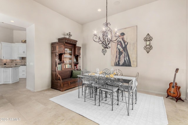 dining room featuring light tile patterned flooring and a notable chandelier