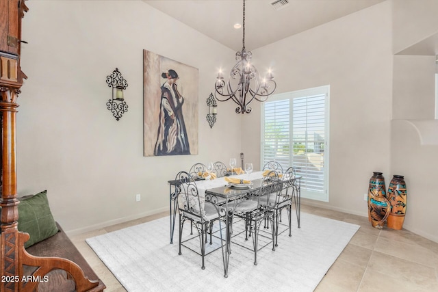 dining room featuring light tile patterned floors and a notable chandelier