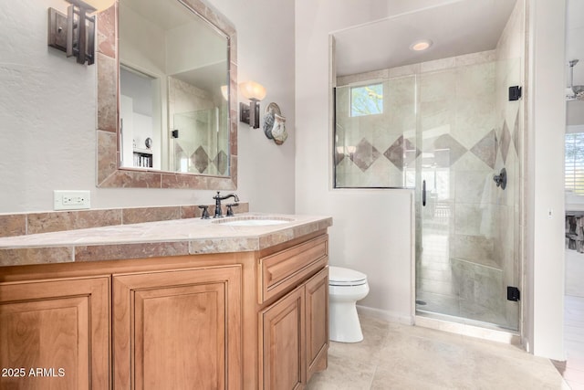 bathroom with vanity, toilet, an enclosed shower, and tile patterned flooring