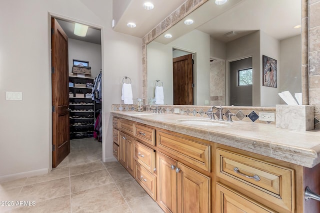 bathroom with vanity, backsplash, and tile patterned floors