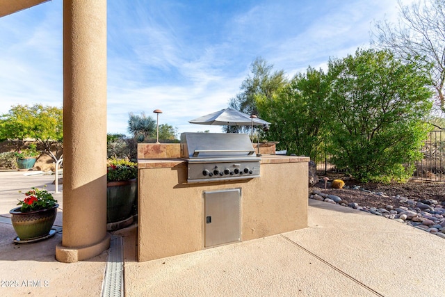 view of patio featuring grilling area and exterior kitchen